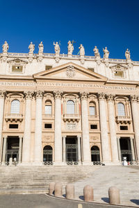 Low angle view of historical building against blue sky