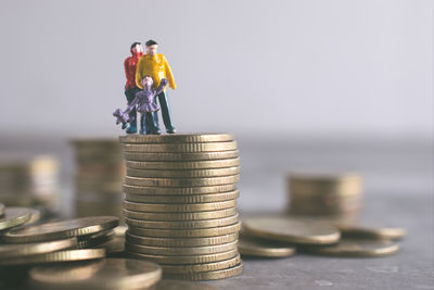 Close-up of coin stack on table