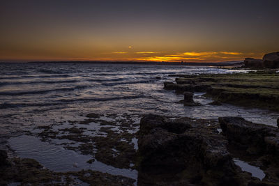 Scenic view of sea against sky during sunset