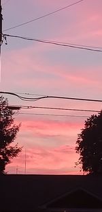 Low angle view of silhouette trees against sky during sunset