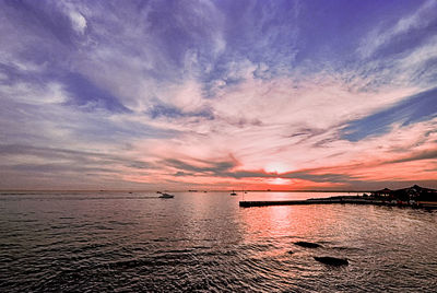 Scenic view of sea against cloudy sky