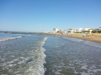 View of sea against clear blue sky