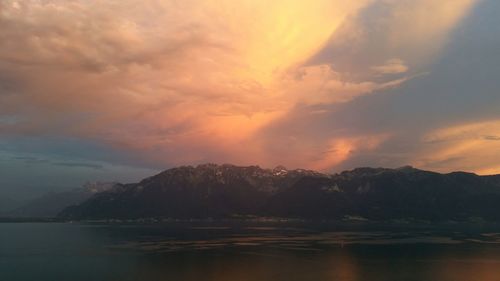 Scenic view of mountains against cloudy sky