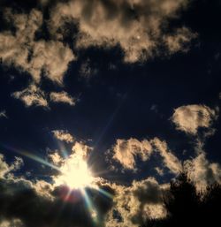 Low angle view of silhouette trees against sky at sunset