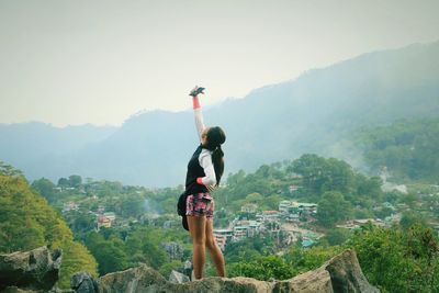 Full length of woman against mountains