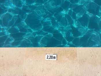 High angle view of text on swimming pool