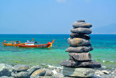 Stack pebbles on the beach at koh hin ngam in tarutao national marine park ,thailand.