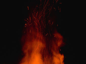 Low angle view of firework display at night