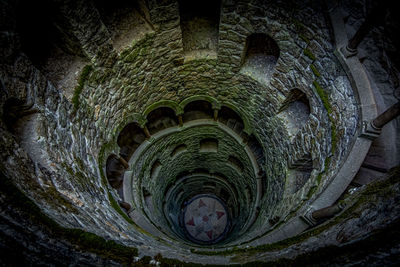 High angle view of spiral staircase in tunnel