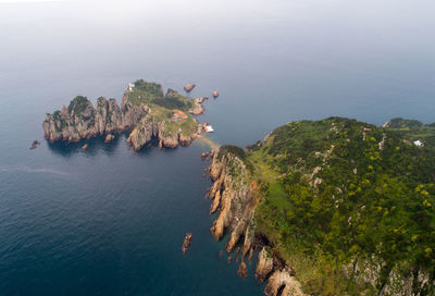 High angle view of rocks by sea