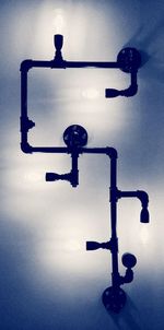 Low angle view of illuminated lamp against sky