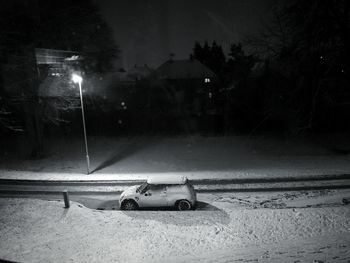 Road against sky at night