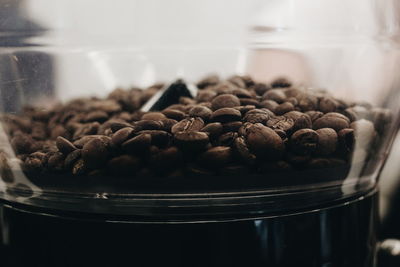 Close-up of coffee beans in glass jar