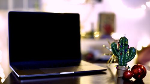 Close-up of laptop on table at home