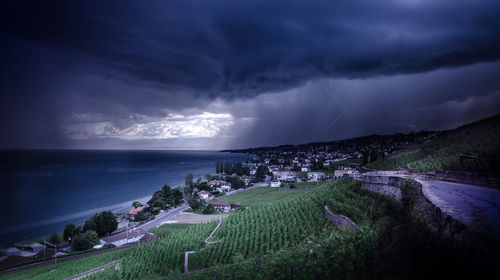 Scenic view of sea against storm clouds