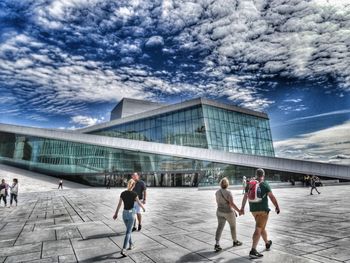 Group of people walking in modern building