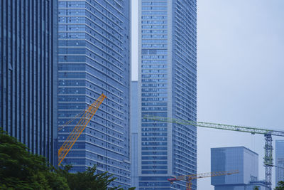 Low angle view of modern buildings against sky