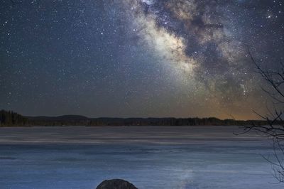 Scenic view of sea against sky at night