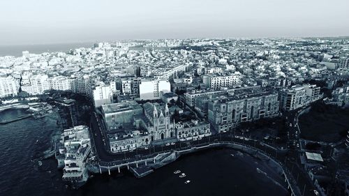 Aerial view of cityscape against sky