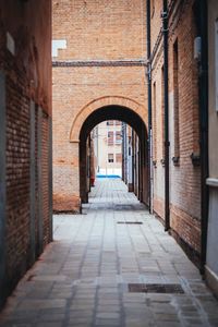 Narrow alley amidst buildings in city