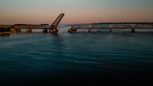 View of bridge over sea against clear sky