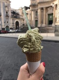 Hand holding ice cream cone