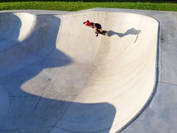 High angle view of woman skateboarding at park