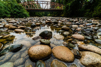 Stones on rocks by river