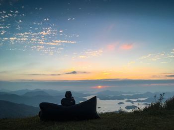 Silhouette of man looking at view