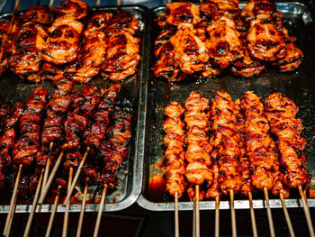 High angle view of meat on barbecue grill