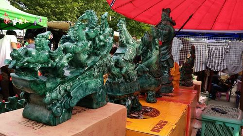 Statue of woman for sale in market