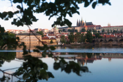 Reflection of buildings and trees in river