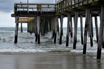 Scenic view of pier over sea against sky