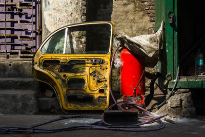 A detached door of a taxi to get repaired