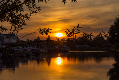 Silhouette of harbor during sunset