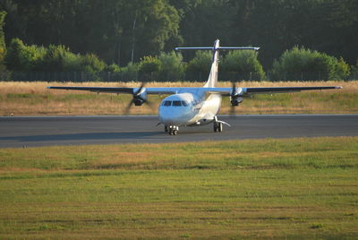 View of airplane at airport runway