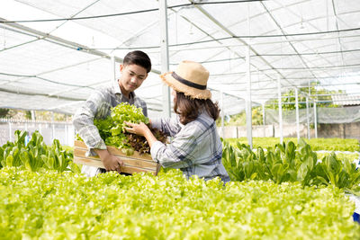 Woman working in greenhouse