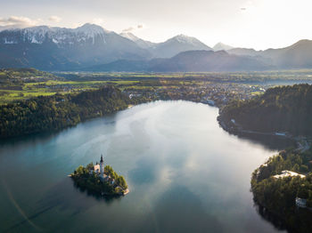 Scenic view of lake and mountains against sky