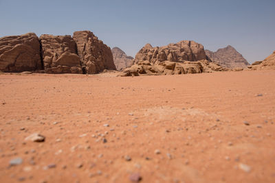 Sand dunes and sandstone cliffs in wadi rum desert , jordan