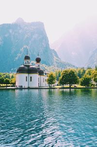 Scenic view of lake and mountains against sky