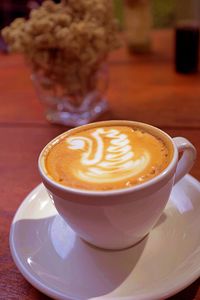 Close-up of cappuccino on table