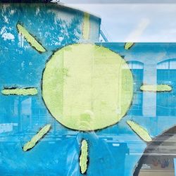 Close-up of graffiti on wall by swimming pool