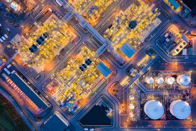 High angle view of city lit up at night