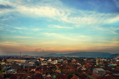 High angle view of town against sky during sunset