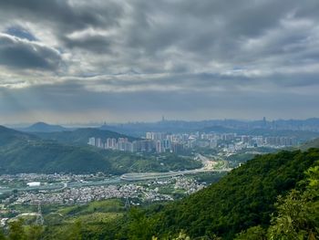 Aerial view of city against sky