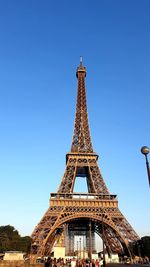 Low angle view of tower against blue sky