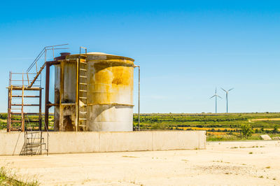 Built structure on field against clear sky