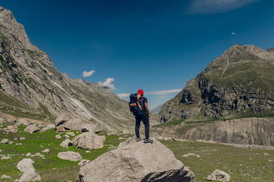 Rear view of man walking on mountain