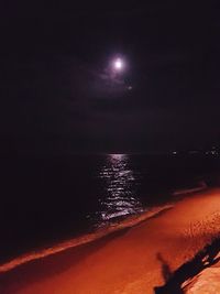 Scenic view of sea against sky at night