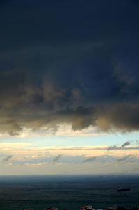 Scenic view of landscape against cloudy sky